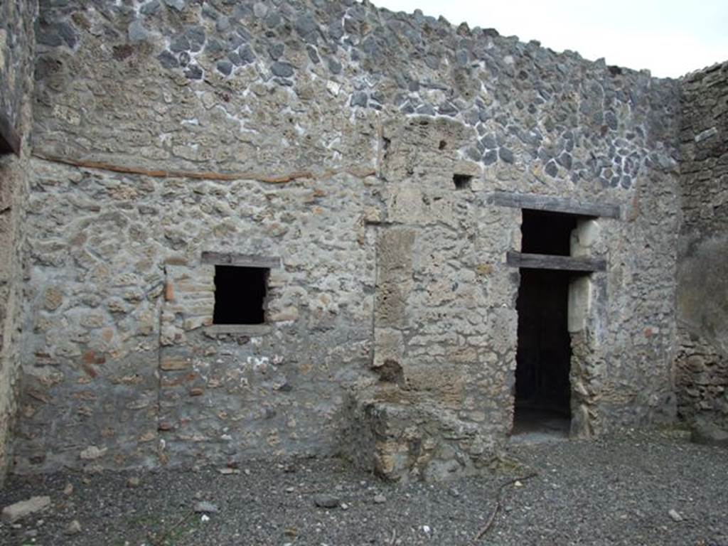 I.9.3 Pompeii. March 2009. Room 1, looking towards east side of atrium.
Window to rear room connected to I.9.4, stairs to upper floor, and doorway to room 3.