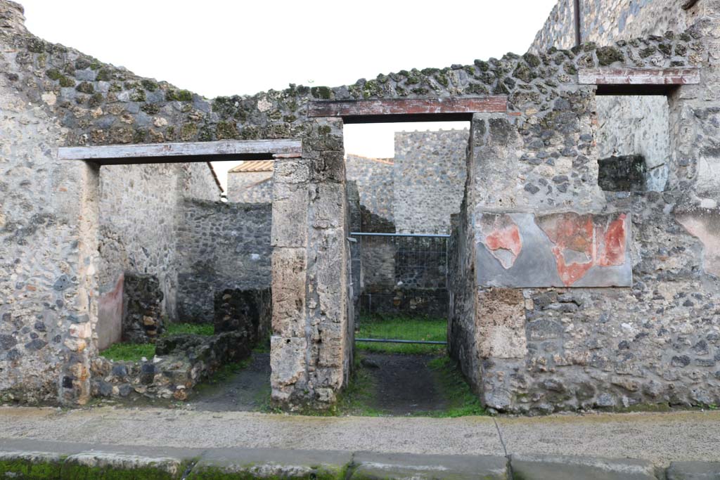 I.10.2 Pompeii, on left. December 2018. Looking south to entrances with I.10.3, on right. Photo courtesy of Aude Durand.