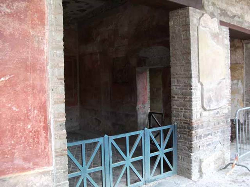 I.10.4 Pompeii. May 2010. Doorway to room 15 from east portico. Looking south-east.