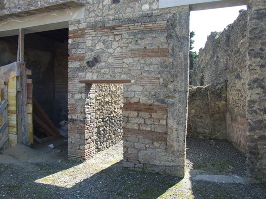 I.10.8 Pompeii. March 2009. South side of atrium, with doorways to room 6, room 7 the corridor, and room 8.