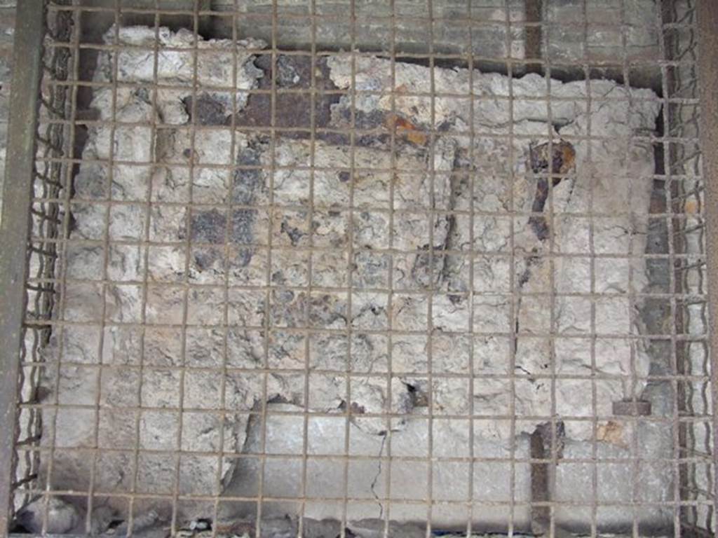 I.12.2 and I.12.1 Pompeii. March 2009. Remains of plaster cast of sliding door for the oven , in situ.