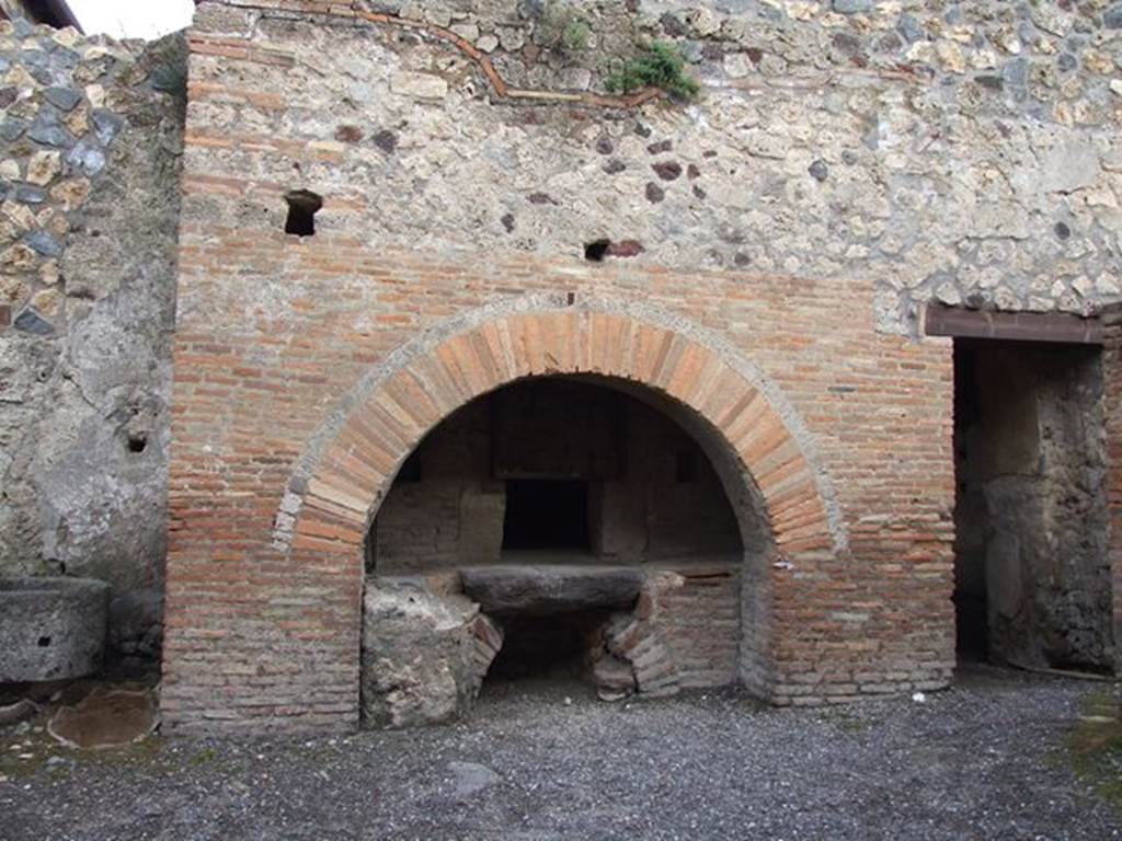 I.12.1 and I.12.2 Pompeii. December 2006. Room 11. Oven and door to Room 13.