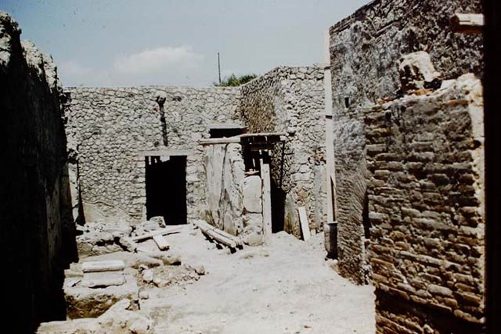 I.12.2 and I.12.1 Pompeii. 1961. Looking north across room 11, with the oven brickwork on the right behind the pilaster. In the centre left is a doorway from room 17 into room 3. Room 17 now has a wall built across its southern end. In the centre is the corridor leading from room 11 to room 3. Photo by Stanley A. Jashemski.
Source: The Wilhelmina and Stanley A. Jashemski archive in the University of Maryland Library, Special Collections (See collection page) and made available under the Creative Commons Attribution-Non Commercial License v.4. See Licence and use details.
J61f0248