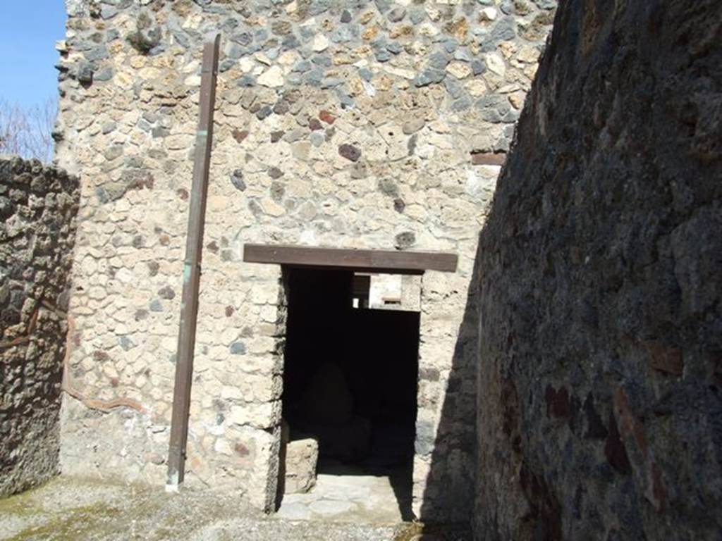 I.12.2 and I.12.1 Pompeii. March 2009 Room 17. North wall with door to room 3.