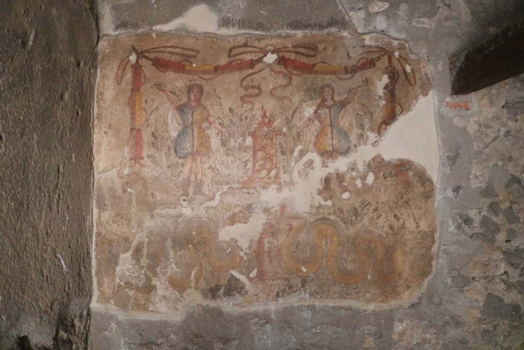 I.12.3 Pompeii. December 2018. 
Room 4, painted lararium on east wall in north-east corner of kitchen. Photo courtesy of Aude Durand.
