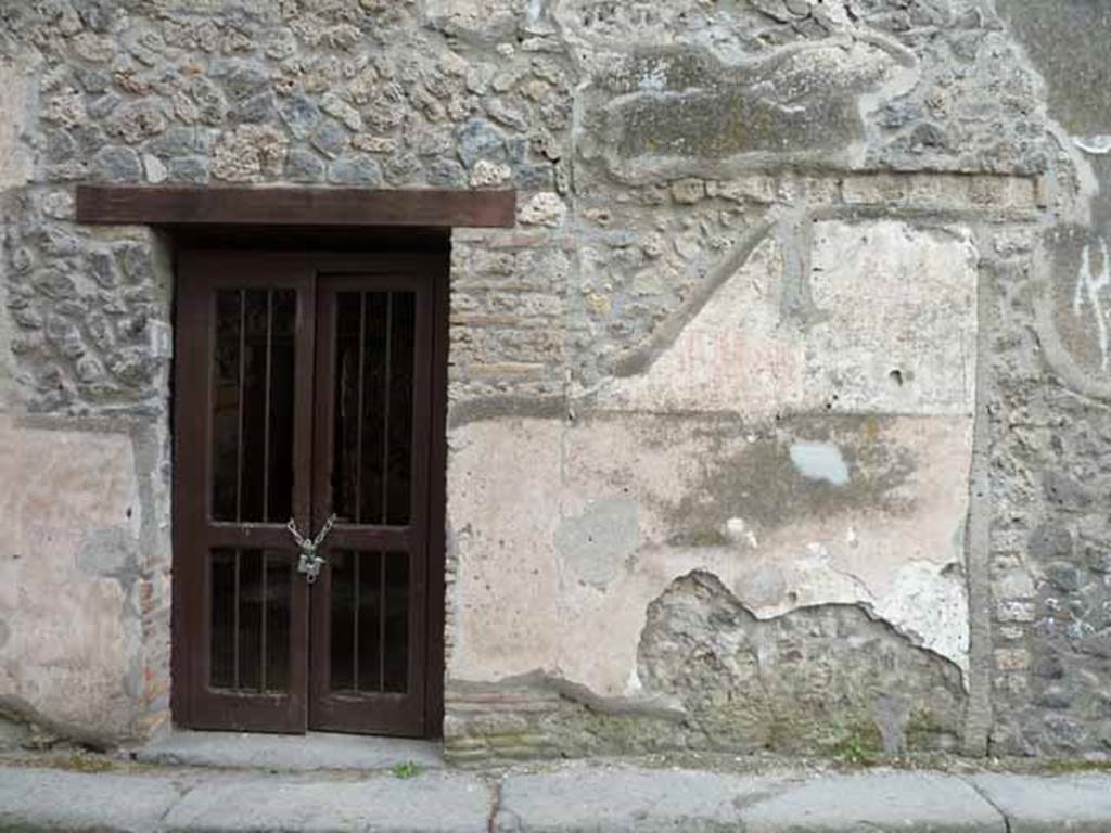 I.13.9 Pompeii. May 2010. North side of entrance doorway, with remains of painted graffiti. 