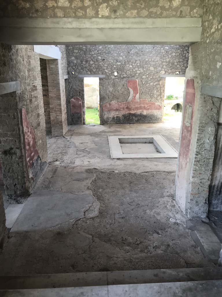 II.4.6/10 Pompeii. April 2019. 
Looking south into atrium of II.4.10, from top of steps at south end of portico of II.4.6. 
To view these rooms, see II.4.10. Photo courtesy of Rick Bauer.  
