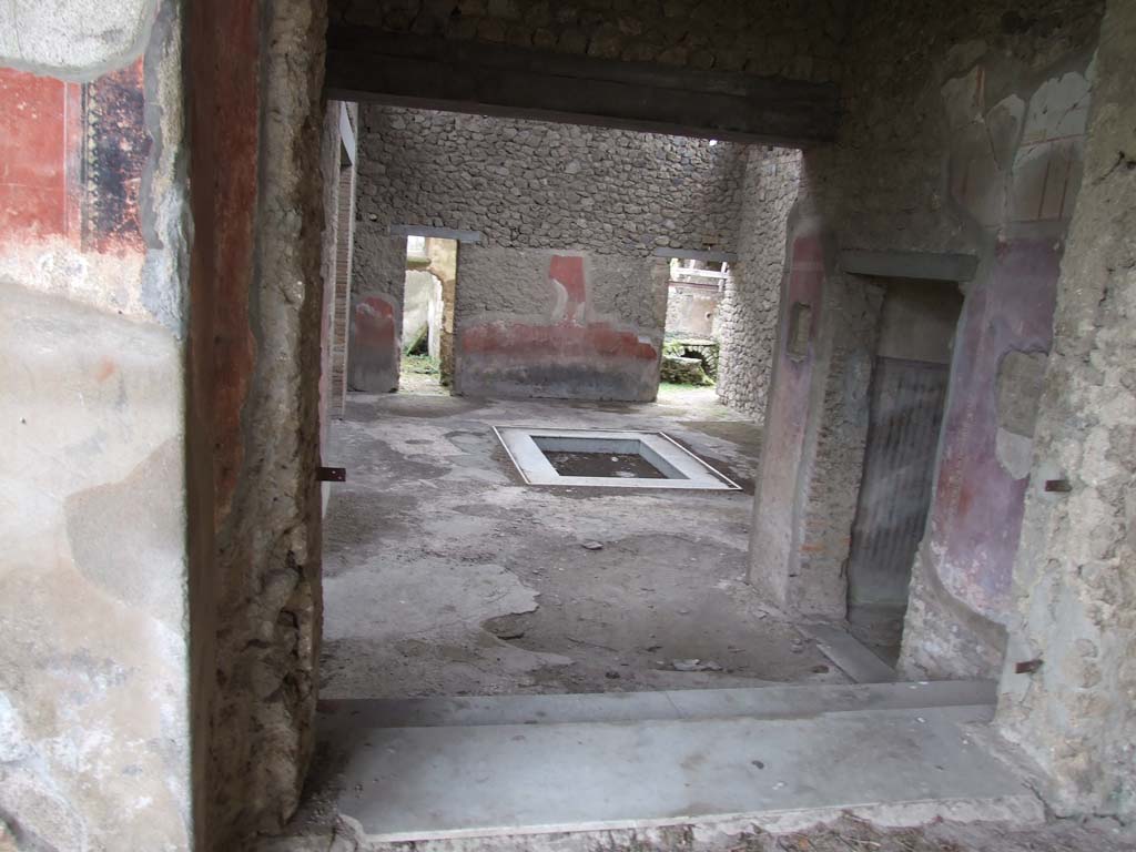 II.4.6 Pompeii. December 2006. Looking south into atrium of II.4.10, from top of steps at south end of portico. 
To view these rooms, see II.4.10.
