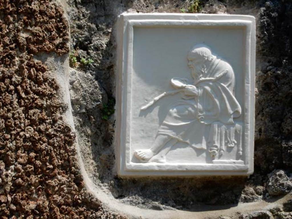 II.4.6 Pompeii. May 2016. Reproduction plaque from an alcove in the garden area. Photo courtesy of Buzz Ferebee.
