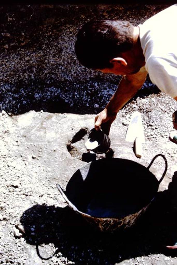 II.5 Pompeii. 1966. Filling the cavity with cement. Photo by Stanley A. Jashemski.
Source: The Wilhelmina and Stanley A. Jashemski archive in the University of Maryland Library, Special Collections (See collection page) and made available under the Creative Commons Attribution-Non Commercial License v.4. See Licence and use details.
J66f0171