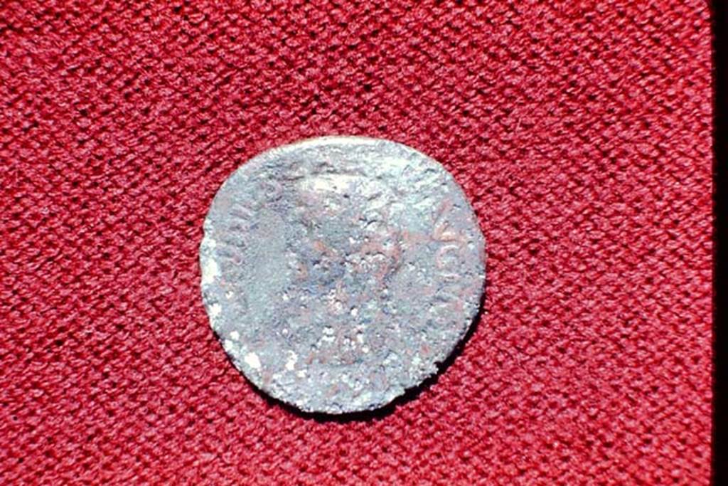 II.5 Pompeii, 1968. Detail of coin. Photo by Stanley A. Jashemski.
Source: The Wilhelmina and Stanley A. Jashemski archive in the University of Maryland Library, Special Collections (See collection page) and made available under the Creative Commons Attribution-Non Commercial License v.4. See Licence and use details.
J68f1795