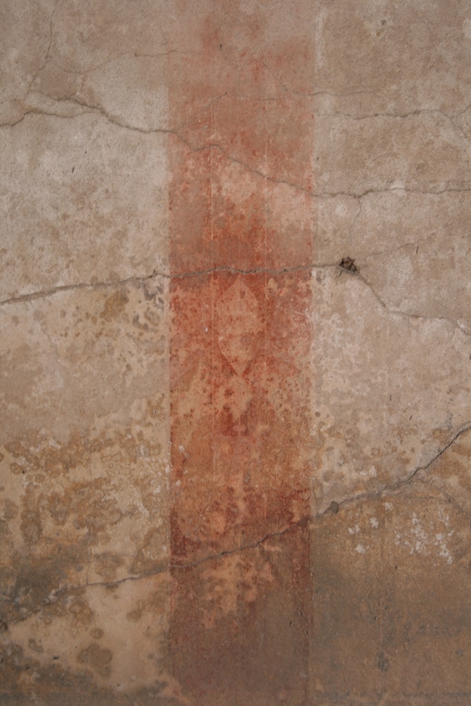 V.1.7 Pompeii. c.2005-7.  
Room 8, detail of painted decoration on east wall. Photo by Thomas Staub.
Photo courtesy of the Swedish Pompeii Project.
