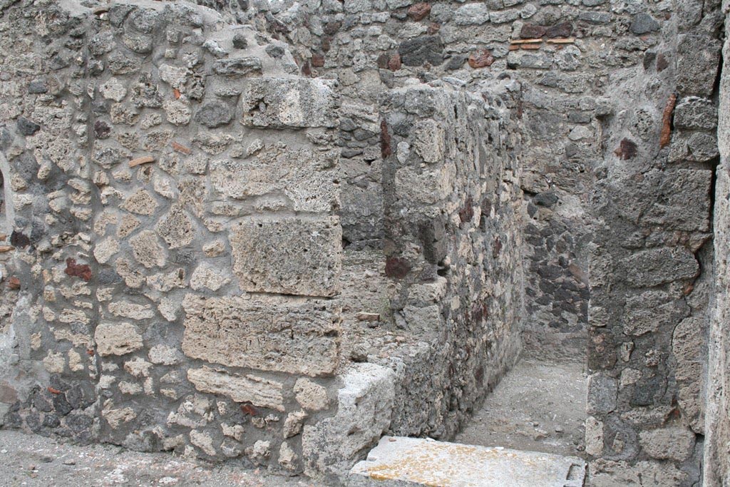 V.1.7 Pompeii. c.2005-7.  
Room 12, looking towards doorway in south-east corner of peristyle “b”. Photo by Thomas Staub.
Photo courtesy of Swedish Pompeii Project.
