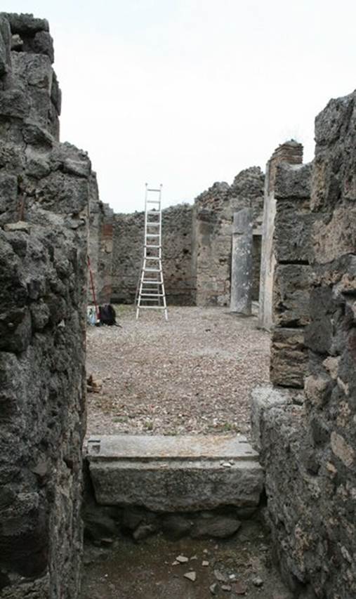 V.1.7 Pompeii. c.2005-7.  
Room 12, west wall with doorway to peristyle “b”. Photo by Thomas Staub.
Photo courtesy of Swedish Pompeii Project.
