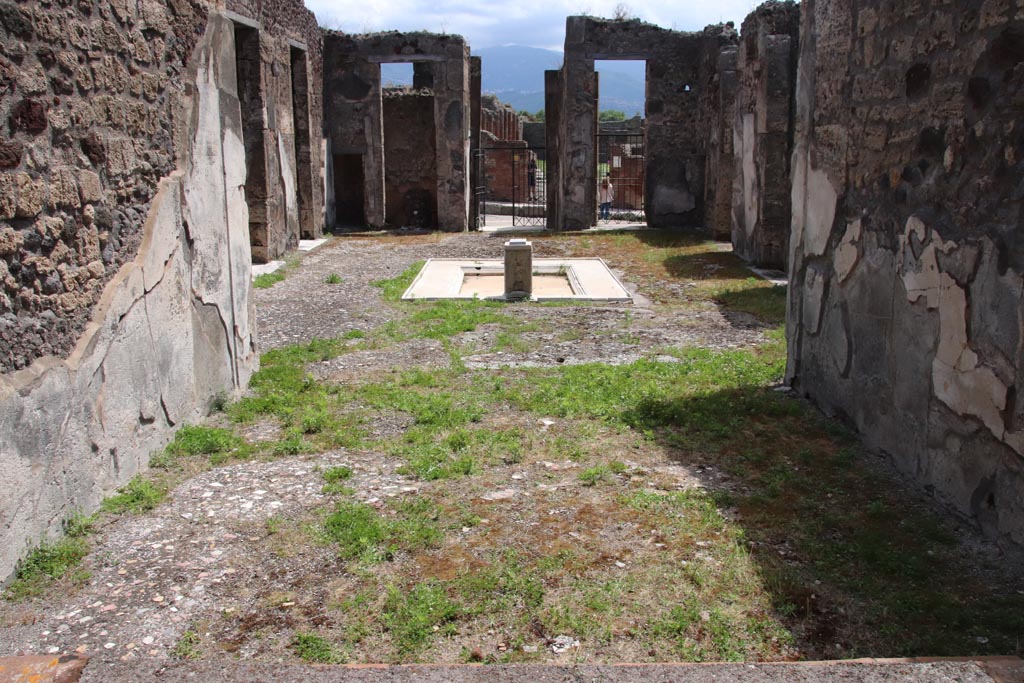 V.1.7 Pompeii. May 2024. Room 13, looking south from tablinum across atrium towards entrance doorway. Photo courtesy of Klaus Heese.