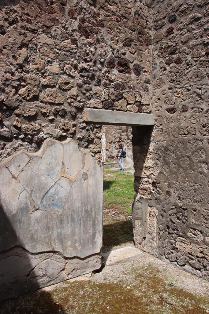 V.1.7 Pompeii. May 2024. 
Room 15, north-east corner, with doorway into room 14. Photo courtesy of Klaus Heese.
