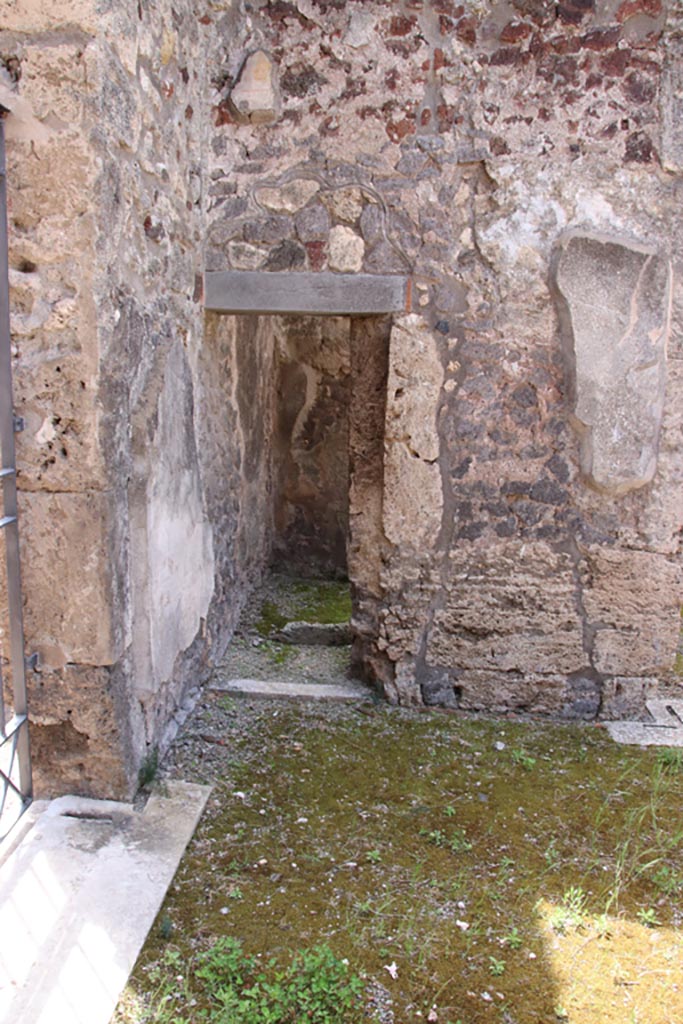 V.1.7 Pompeii. May 2024. 
Room17, doorway in south-west corner of atrium. Photo courtesy of Klaus Heese. 
