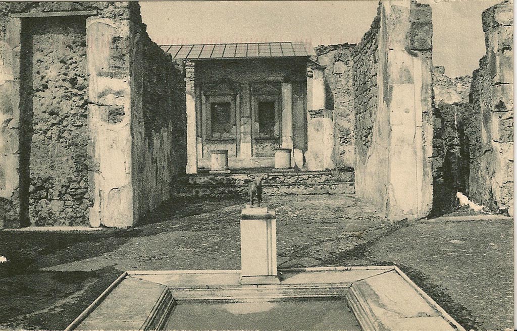 V.1.7 Pompeii. 1920s-1930s postcard. Looking north across impluvium in atrium with model of bronze bull, in situ. 
Photo courtesy of Rick Bauer.
