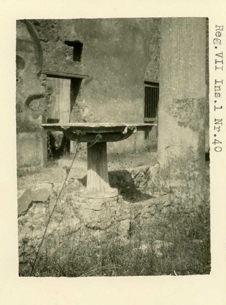 V.1.26 Pompeii (but shown as being VII.1.40 Pompeii.) Pre-1937-1939 
Looking north across portico towards doorways to room “p”, on left, and “q”, at east end of north portico.
Photo courtesy of American Academy in Rome, Photographic Archive. Warsher collection no. 477.

