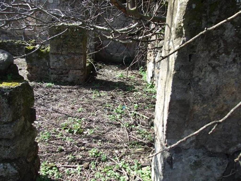 V.4.13 Pompeii.  March 2009.  Door on west wall of atrium or light yard, leading intoTablinum.