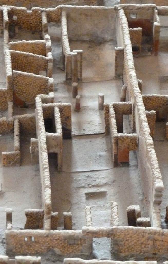 VI.2.16 Pompeii. May 2010. Looking east from entrance in Vicolo di Narciso towards other entrance at VI.2.21 in Vicolo di Modesto. Model as viewed in Naples Archaeological Museum.