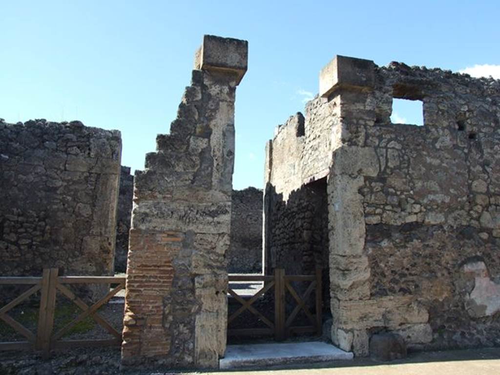 VI.7.9 Pompeii. March 2009. Entrance doorway in centre. According to Della Corte, there were four paintings on the external pilasters, Minerva, Mercury and attributes of the Fortuna, group of Daedalus and Pasiphae, and a parade in honour of Minerva and Daedalus.
He thought this proved that here was a carpenter’s workshop, and annexed dwelling. On the ground floor, encumbered by the operations of a carpentry workshop and by the deposits of raw wood, there was no place for a dwelling. This was located on the upper floor, accessible by steps. Due to the electoral recommendation written on the north (right) side of number 9, Della Corte concluded the proprietor’s name could have been Tullius –
Tullius facit    [CIL IV 214]
See Della Corte, M., 1965.  Case ed Abitanti di Pompei. Napoli: Fausto Fiorentino. (p.52 (VI.7.8-12)
According to Epigraphik-Datenbank Clauss/Slaby (See www.manfredclauss.de) CIL IV 214 read as -
Vedium Siricum 
quinq(uennalem) Tullius faci[at]
