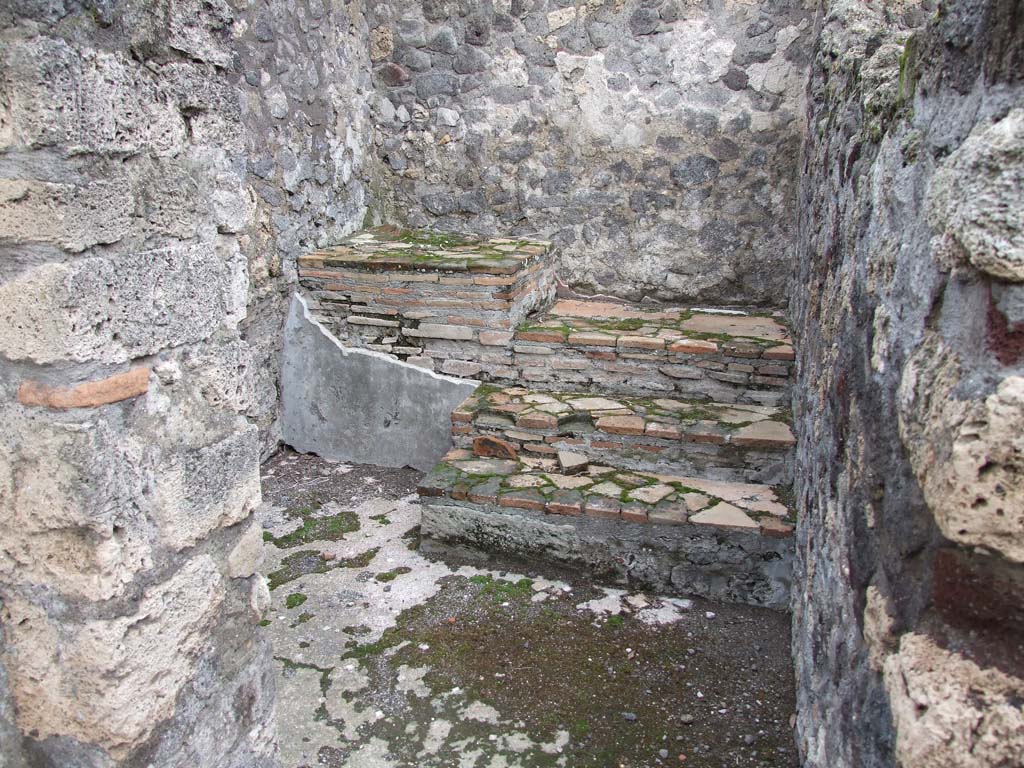 VI.7.23 Pompeii. December 2006. Looking north through doorway to room with stairs to upper floor, leading to kitchen area, on left.