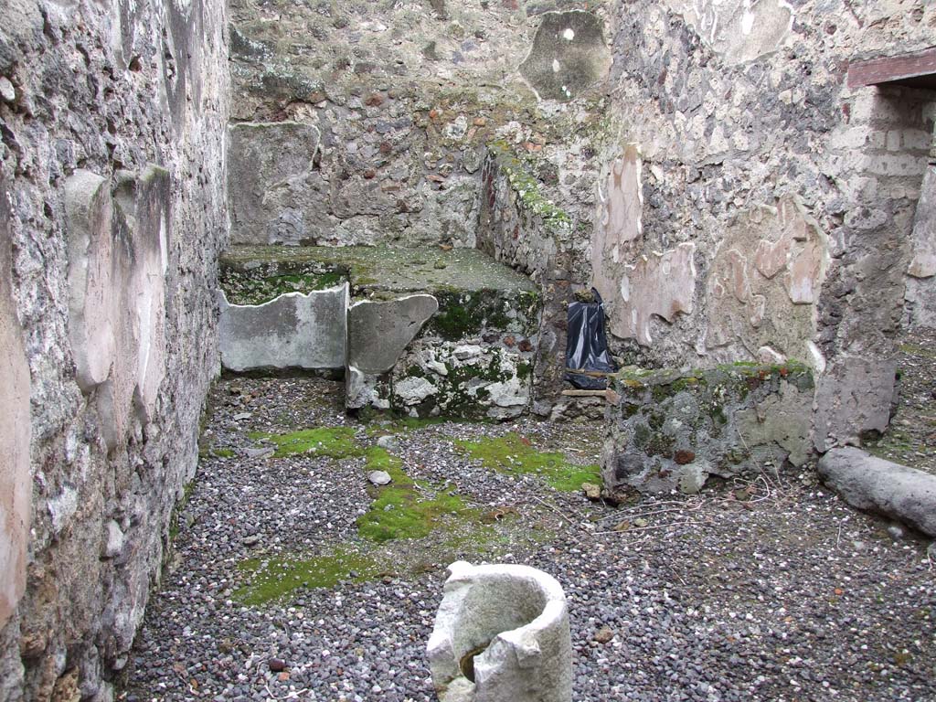 VI.7.23 Pompeii. December 2006. Looking west in kitchen. The doorway on the right leads into an adjacent room.