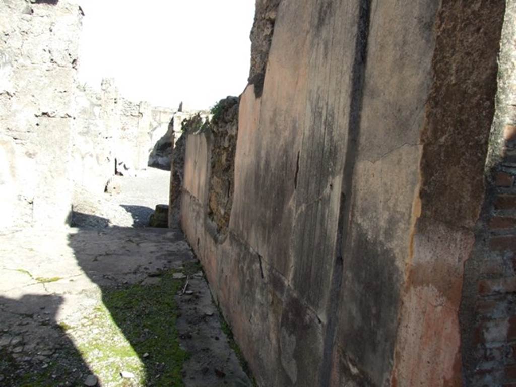 VI.8.22 Pompeii.  March 2009.  Room 12.  Triclinium.  Looking east along south wall towards door to atrium.