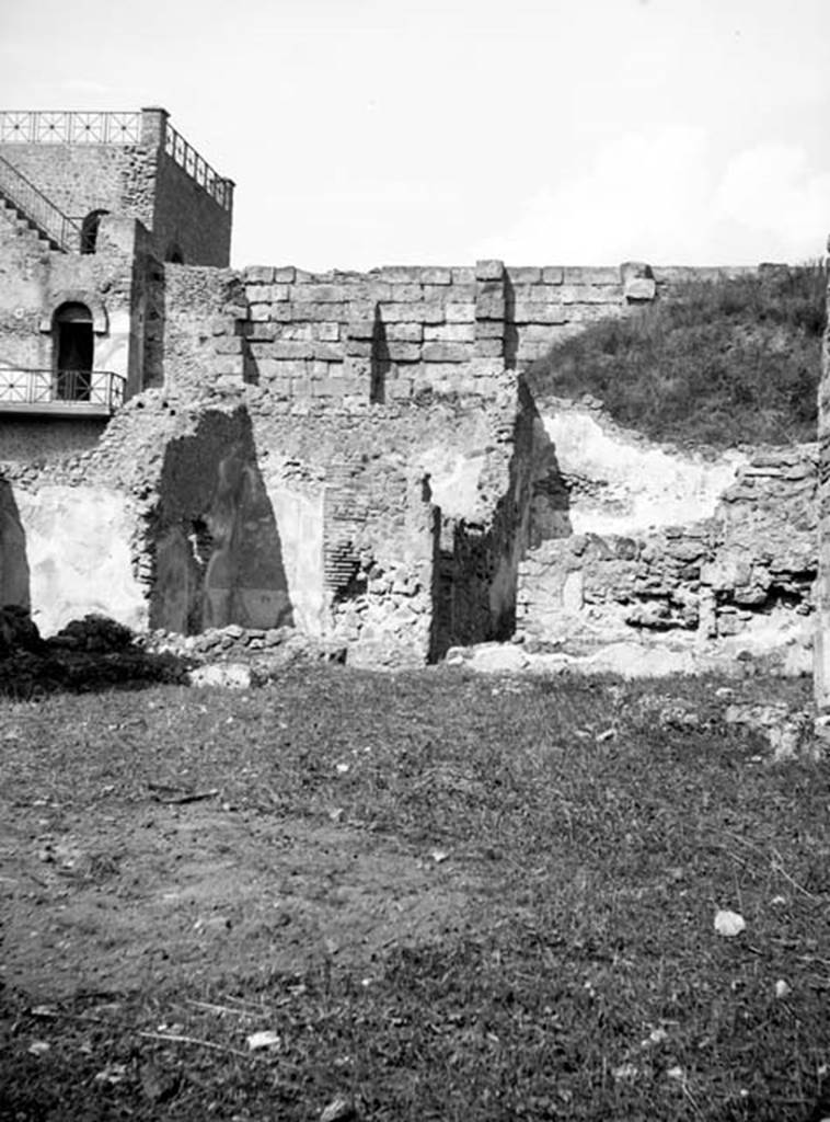 231225 Bestand-D-DAI-ROM-W.637.jpg
6.9.1 Pompeii. W637. 
Looking north from garden area (room 18) towards rooms 12, 11, and small corridor leading to room 8.
Photo by Tatiana Warscher. With kind permission of DAI Rome, whose copyright it remains. 
See http://arachne.uni-koeln.de/item/marbilderbestand/231225  
According to Warscher, in room 11, (Warschers room L the yellow triclinium, seen left of centre in the photo), in the left wall was a hole. It could not be excluded that this hole was what remained after the painting of Io was taken out.
See Warscher, T, 1938: Codex Topographicus Pompejanus, Regio VI, insula 9: Pars prima, (no.17c), DAIR, Rome.  
