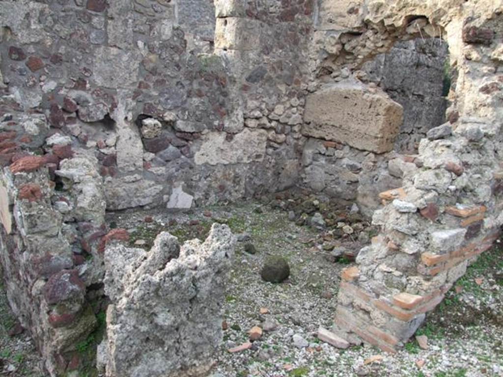 VI.9.1 Pompeii. December 2007. Room 19, looking north-west through remains of doorway.
According to Packer, in number 19 (or 6), the walls would have been decorated with white panels with narrow red borders below a moulded stucco cornice.
According to Warscher, in her room “e” (our room 19), she could see traces of paintings on the west wall: three panels were separated by vertical bands.
In the middle of the central panel – size 1,20m wide – there was a medallion of 0,18m diameter. On the side panels were painted birds. The painting was very rough.
See Warscher, T, 1938: Codex Topographicus Pompejanus, Regio VI, insula 9: Pars prima, DAIR, Rome.  
