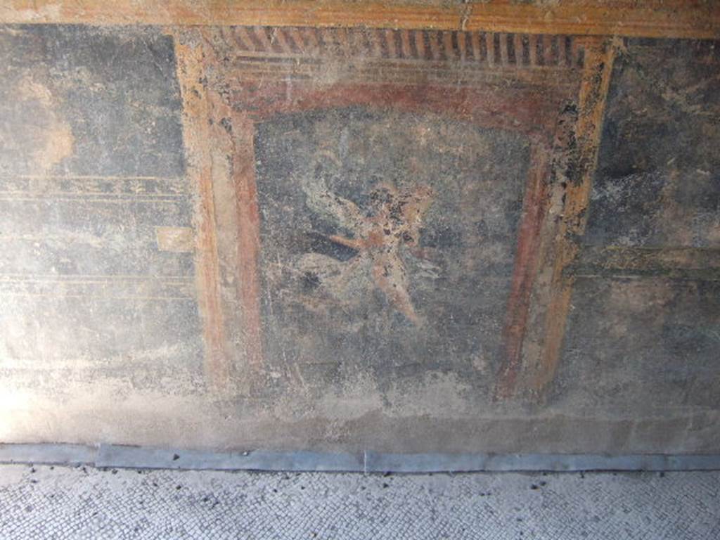 VI.9.6 Pompeii. March 2009. Room 8, painted winged figure, from the dado of the north wall.