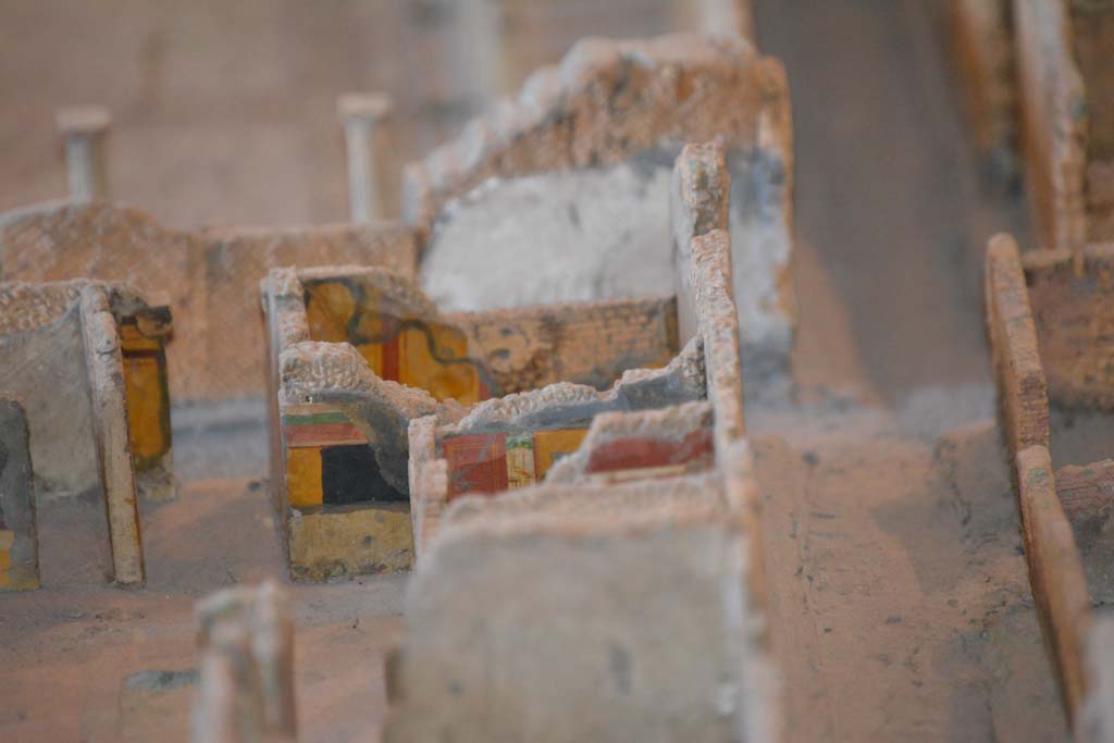 VI.11.9/10 Pompeii. July 2017. Looking towards south-west corner of atrium 3, with Vicolo del Fauno, on right.
Above the yellow/black wall of the atrium is the south wall of room 5, unseen in front of it would be corridor 4.
The red/yellow south panelled wall of room 6 can be seen, with a small part of the remaining red painted upper south wall of west ala 7, in the centre.
From cork model in Naples Archaeological Museum.
Foto Annette Haug, ERC Grant 681269 DCOR.
