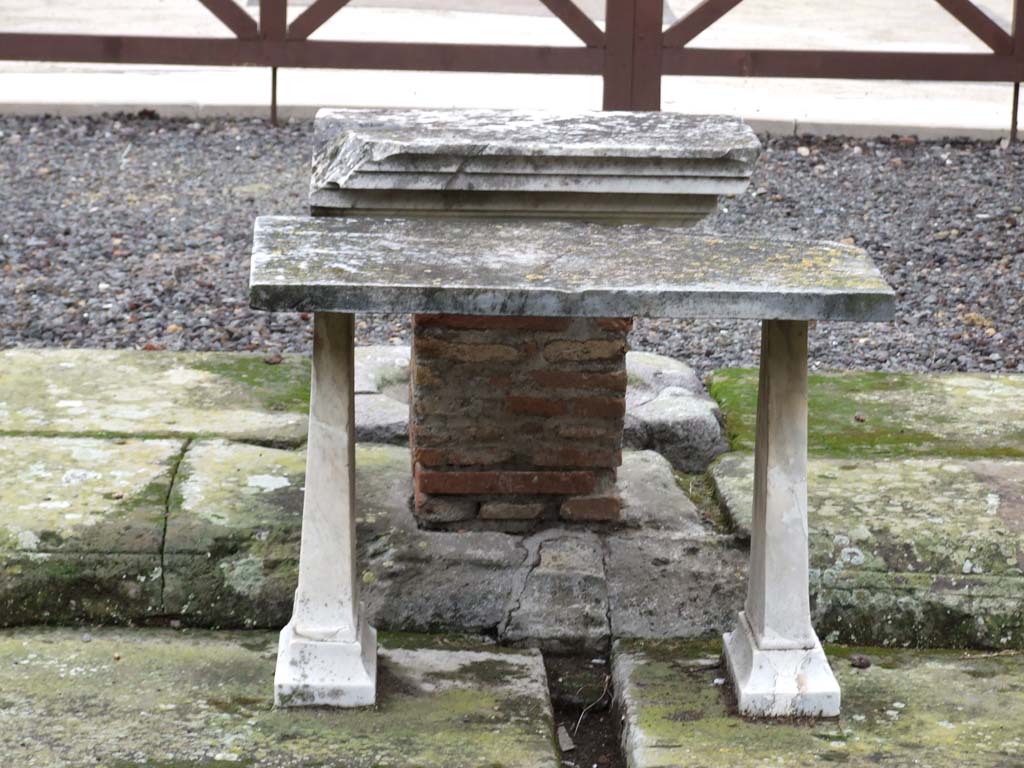 VI.11.10 Pompeii. December 2006. Marble table or cartibulum in Tetrastyle atrium 27, looking north.