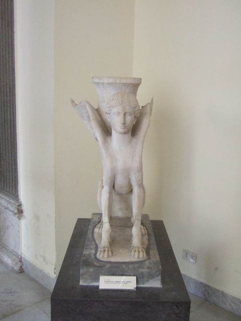 VI.12.2 Pompeii. Marble table support in the form of a sphinx. Found in second peristyle. Now in Naples Archaeological Museum. Inventory number 6869.