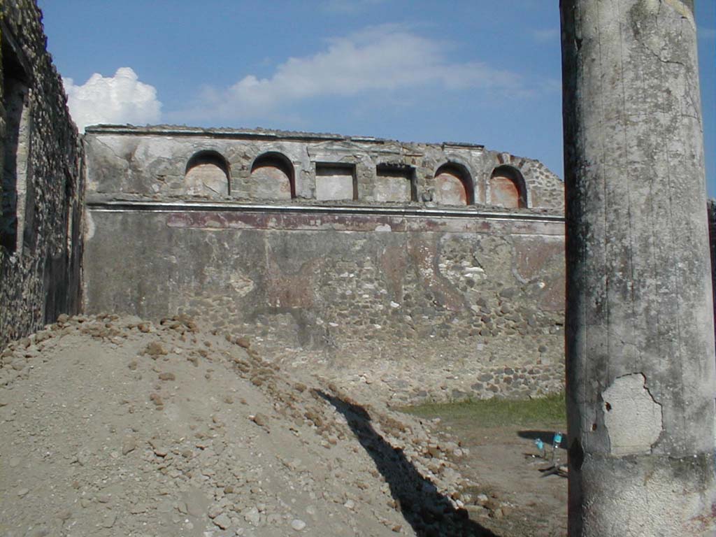 VI.13.19 Pompeii. September 2005. Looking east across garden area towards rear wall, with six niches high up in the wall.
According to Jashemski, the rear wall had an animal painting on the wall, now totally destroyed.
A terracotta statue of a boy was found in one of the niches.
Now in Naples Archaeological Museum. Inventory number: 110395.
She also said fragments of a similar statuette was found in another niche, but no further details.
See Jashemski, W. F., 1993. The Gardens of Pompeii, Volume II: Appendices. New York: Caratzas. (p.148 & p.344, no.53)