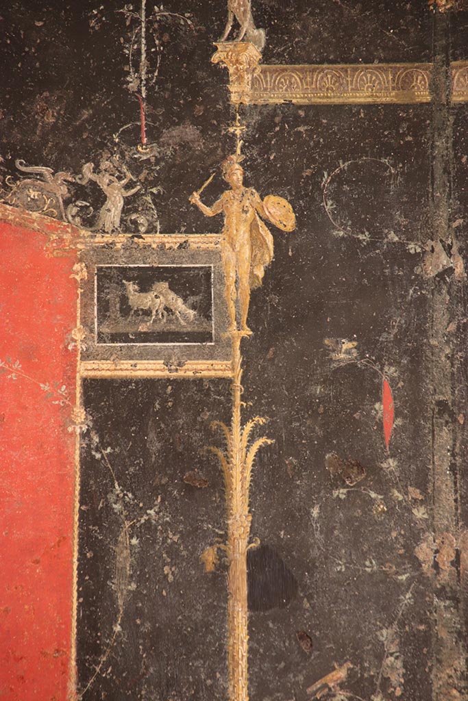 VI.15.1 Pompeii. October 2024. 
Detail from top of candelabra from left side of panel at west end of north wall. Photo courtesy of Klaus Heese.
