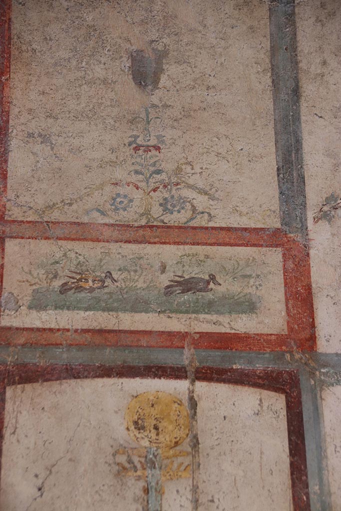 VI.15.1 Pompeii. October 2024. 
Room (f), detail of painted panel with ducks, from west wall. Photo courtesy of Klaus Heese.
