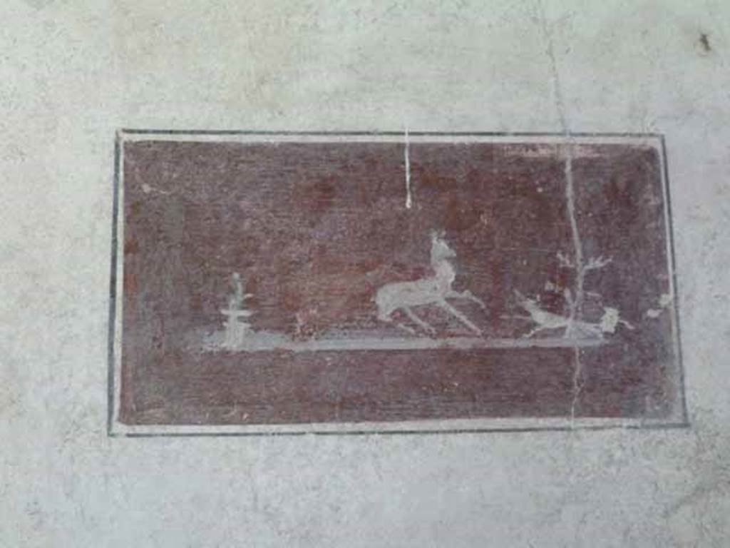 VI.15.8 Pompeii. May 2010. Painted panel of hunting scene on north wall of tablinum.