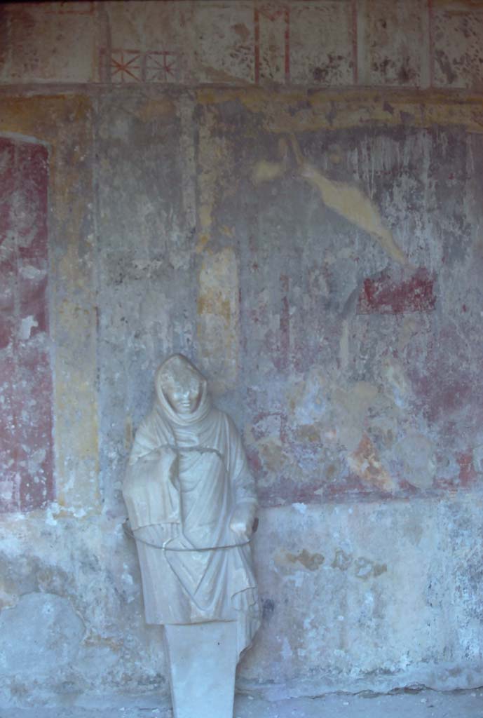 VII.1.8, Pompeii. 4th December 1971. Statue of a woman in north portico B. 
Photo courtesy of Rick Bauer, from Dr George Fay’s slides collection.

