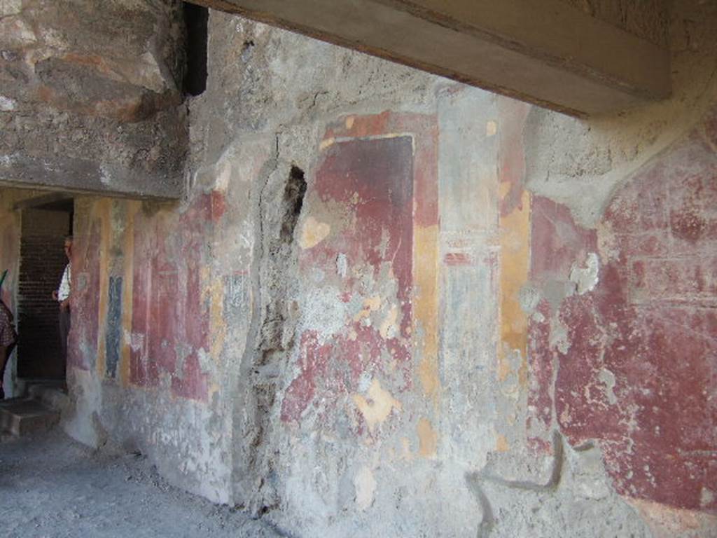 VII.1.8 Pompeii. December 2006. Wall of north side of portico B, looking west.