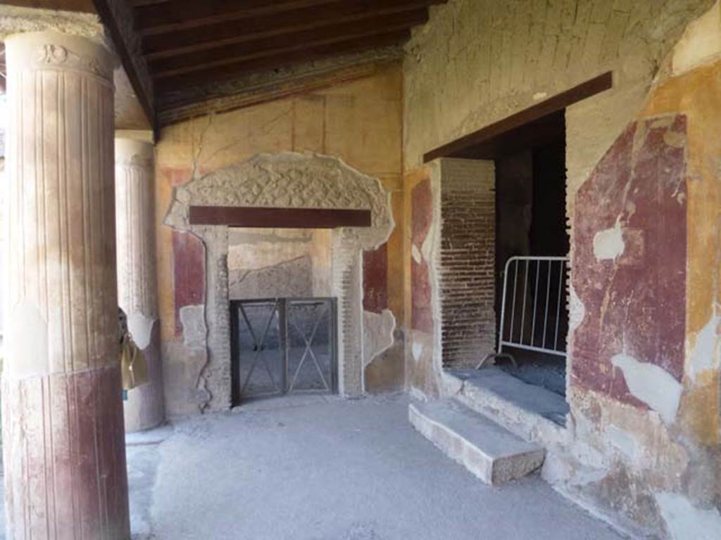 VII.1.8 Pompeii. June 2012. Looking west along north portico B. Ahead is room Q, the office of the baths superintendent. To the right is the entrance to corridor J, the latrine O, and entrance VII.1.50. Photo courtesy of Michael Binns.