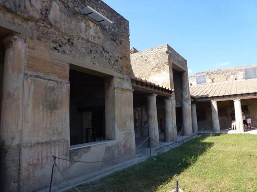 VII.1.8 Pompeii. June 2012. Looking east past room Q and along north portico. Photo courtesy of Michael Binns.