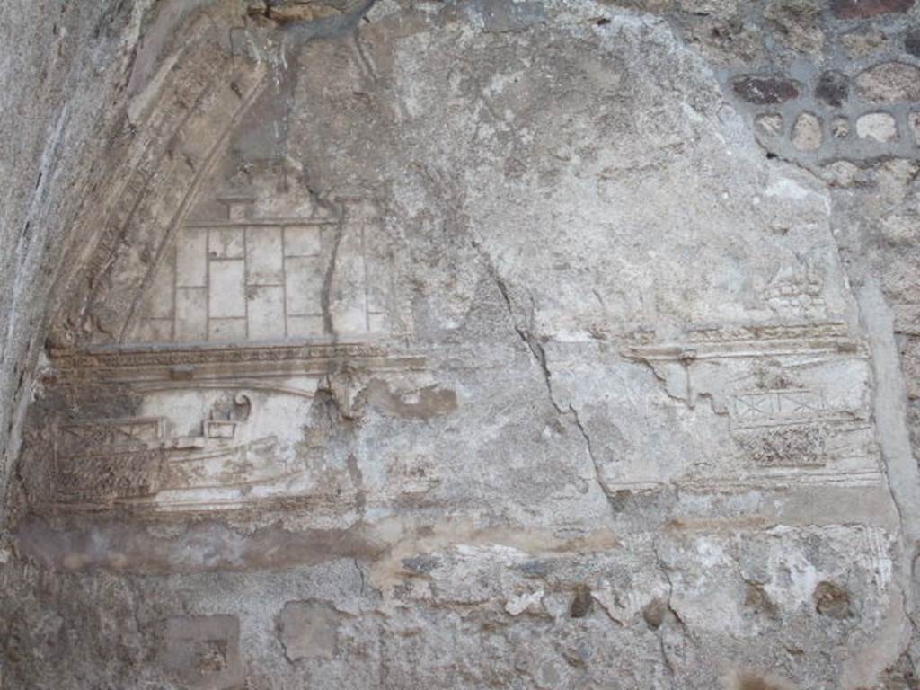 VII.1.8 Pompeii. December 2006. Plaster on west wall of tepidarium 3. 