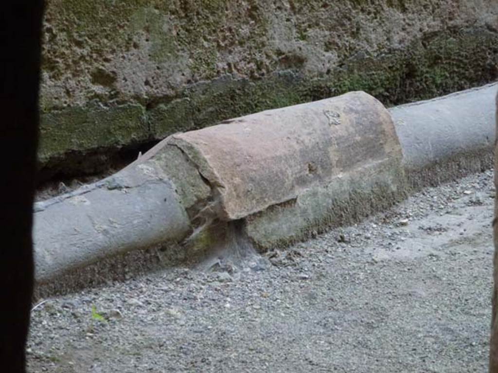 VII.1.8 Pompeii. June 2012. Detail of lead pipe in corridor 12. Photo courtesy of Michael Binns.