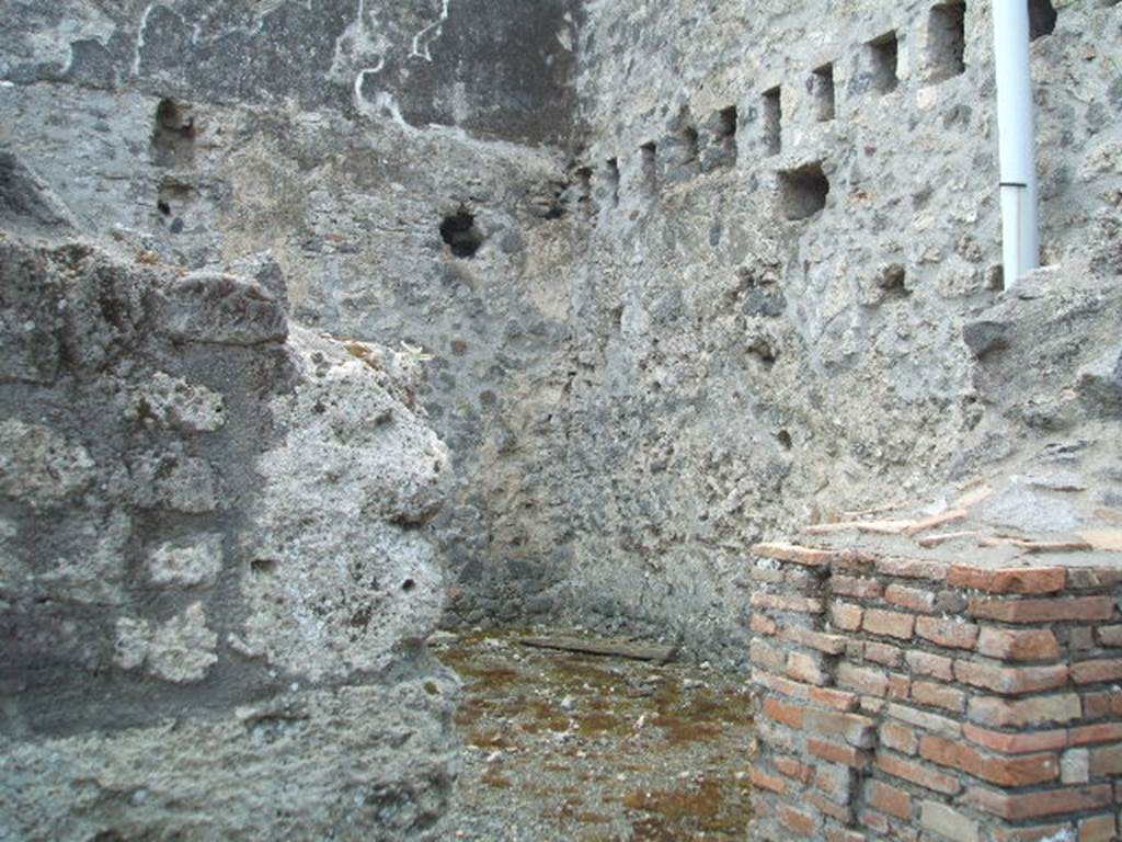 VII.1.16 Pompeii. May 2005. Looking into room on south of workshop, on left from entrance.