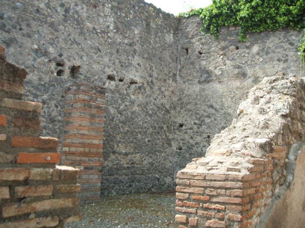 VII.1.16 Pompeii. May 2005. Looking south towards south-west corner of workshop, from VII.1.17