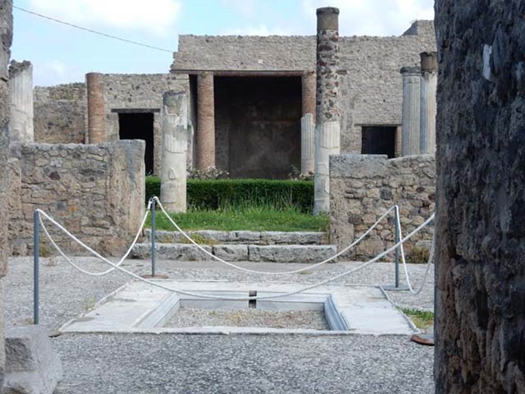 VII.7.5 Pompeii. May 2015. Looking north across marble impluvium in atrium (b).
The floor of the atrium is a beaten mixture of small fragments of marble.
Photo courtesy of Buzz Ferebee.