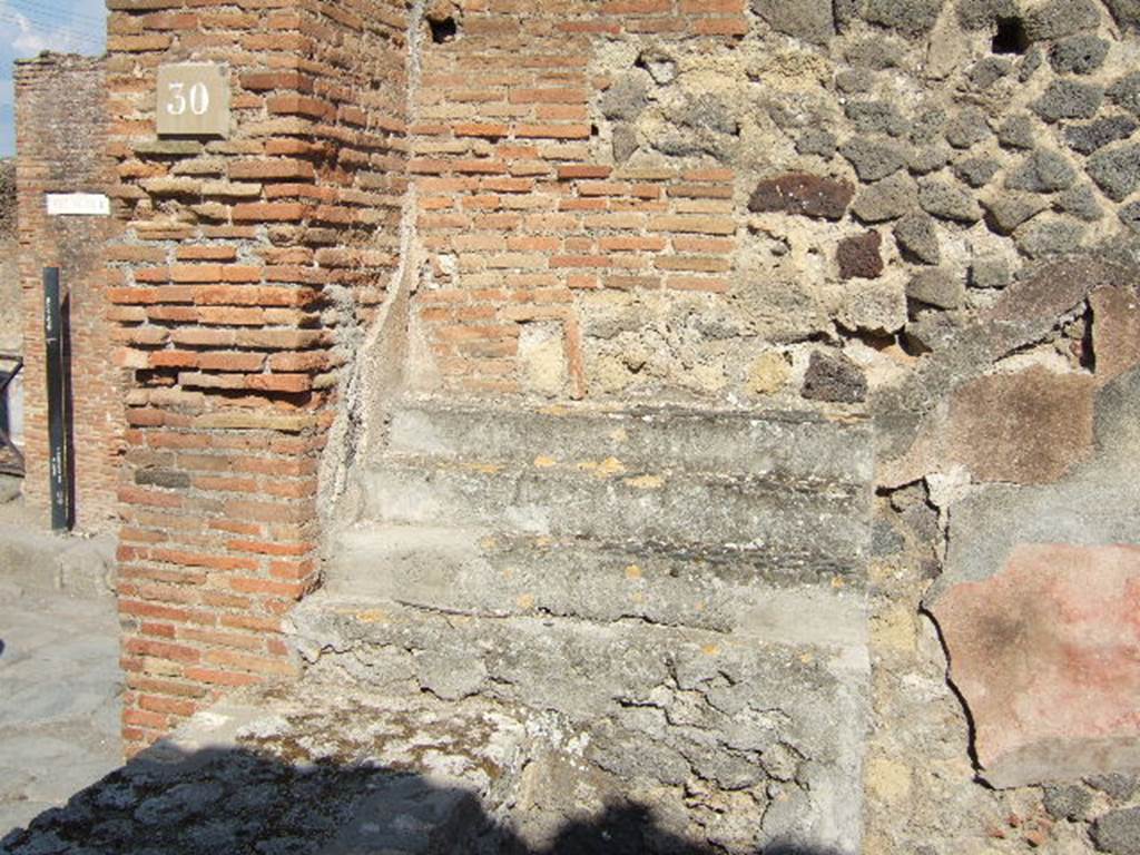 VII.9.30 Pompeii. September 2005. Shelves for displaying crockery at east end of counter.