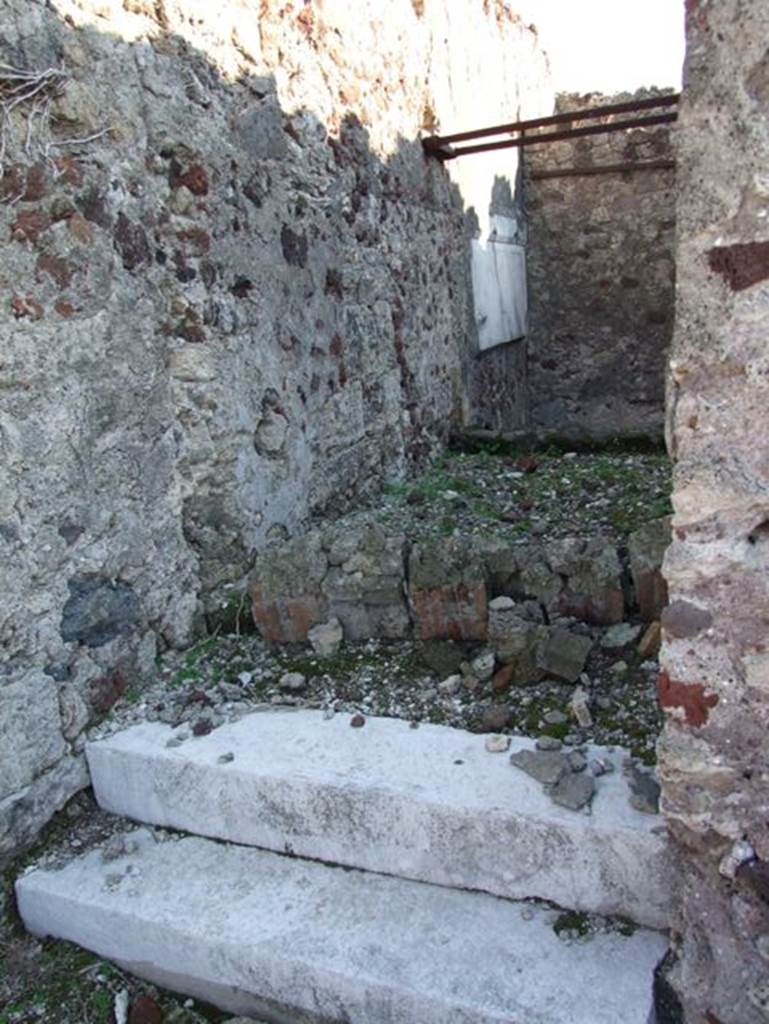 VII.15.2 Pompeii. December 2007. Looking south. Room on western side of house accessed by two marble steps. The room was built at a slightly higher level than the other ground level rooms. This was to accommodate the ramp descending to the subterranean rooms.